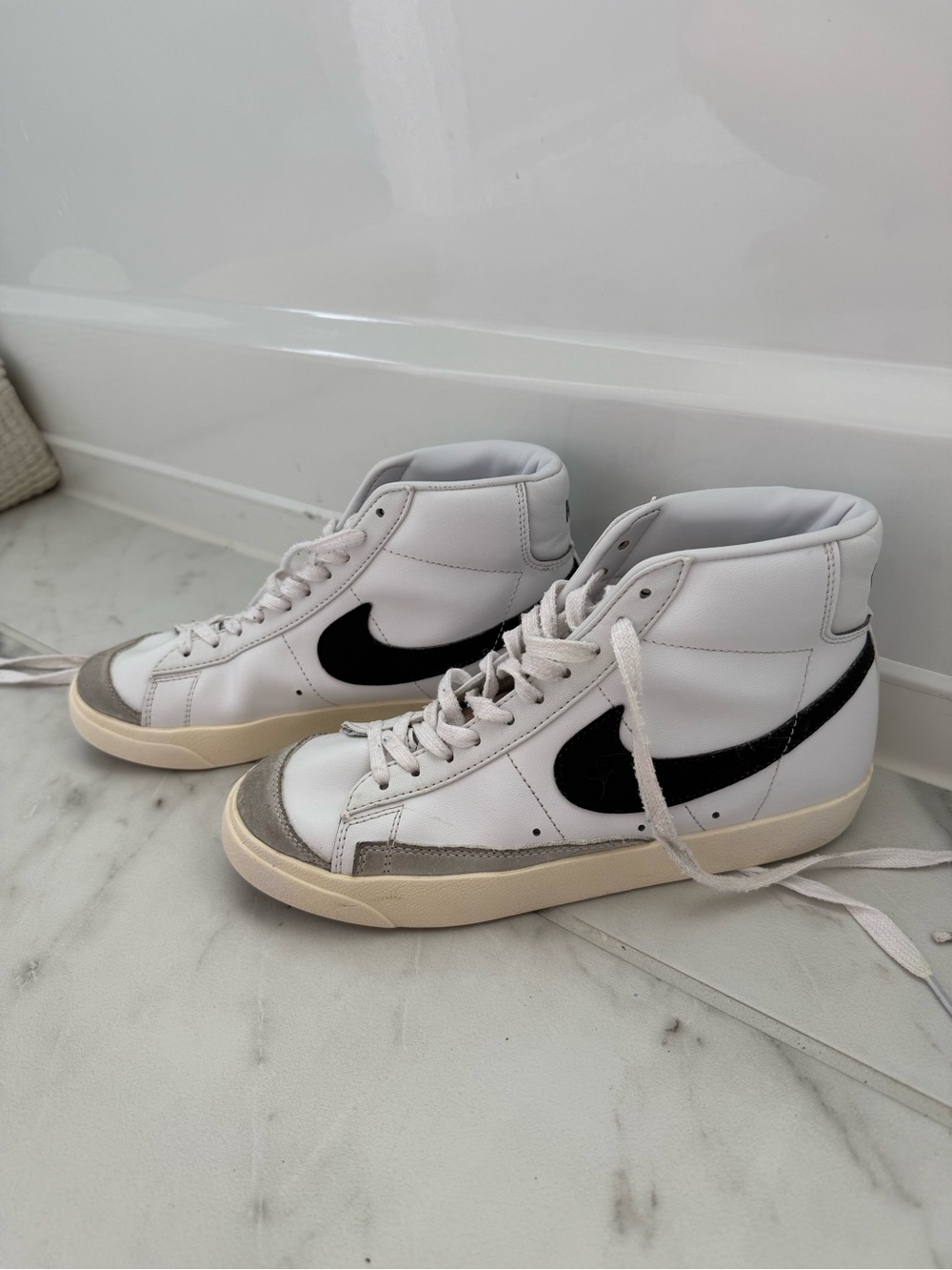 Women’s Nike Blazer Mid '77 white sneakers with black swoosh